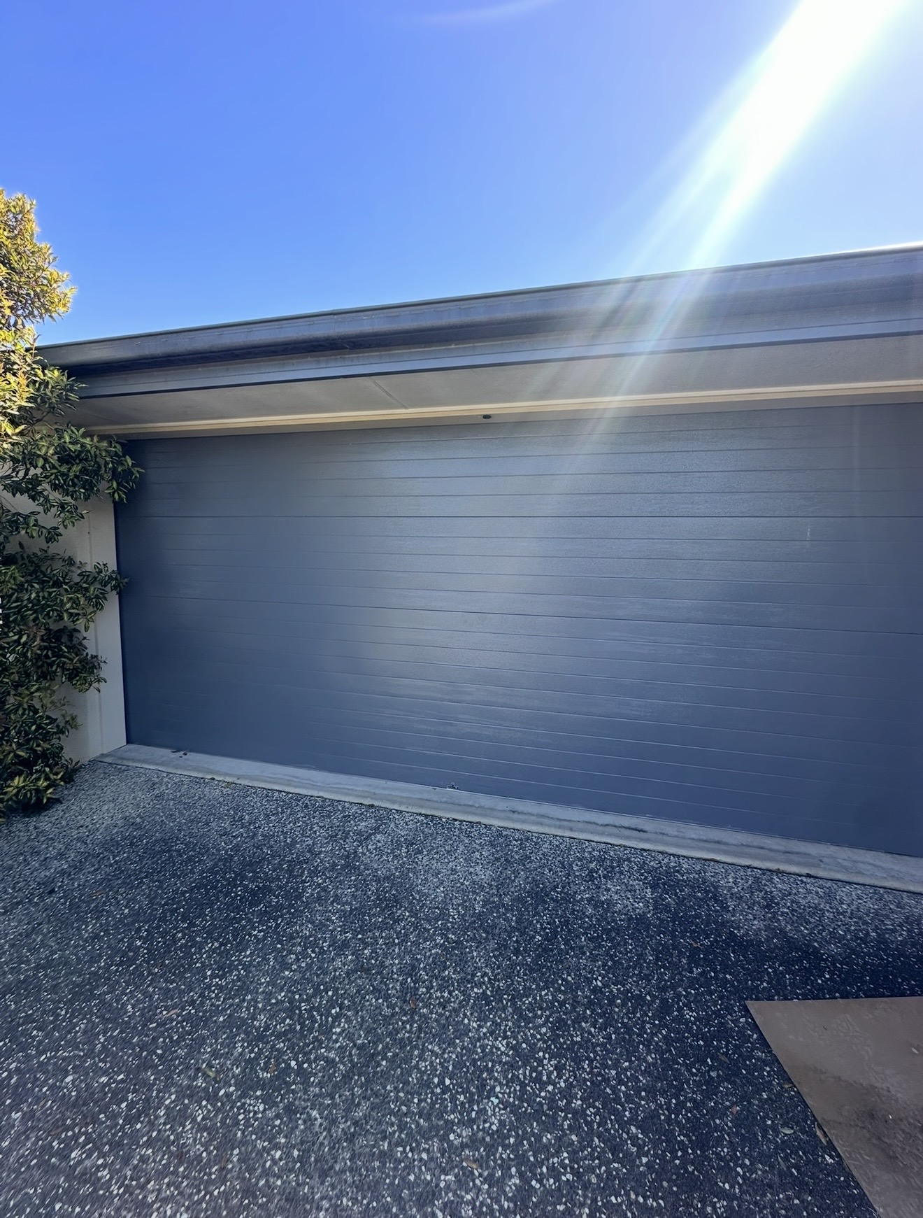 Garage door repair at a family home near Coombabah wetlands in Hollywell