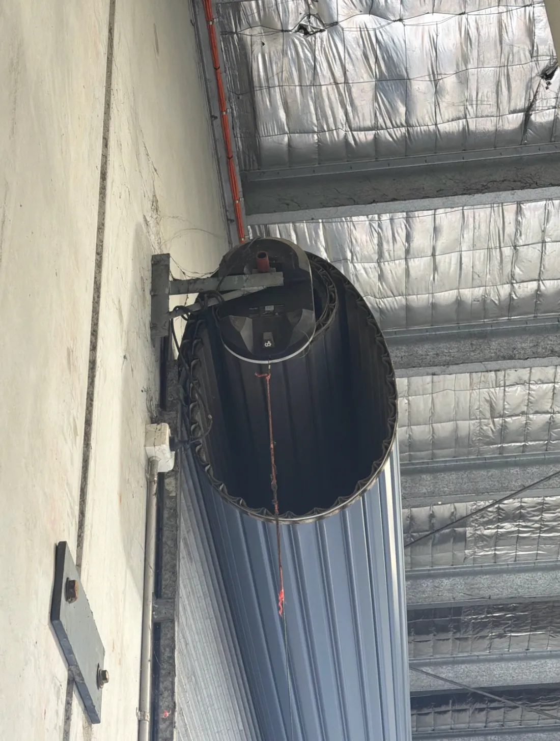 Commercial roller door curtain and drum with new heavy-duty motor installed at the Stapylton workshop