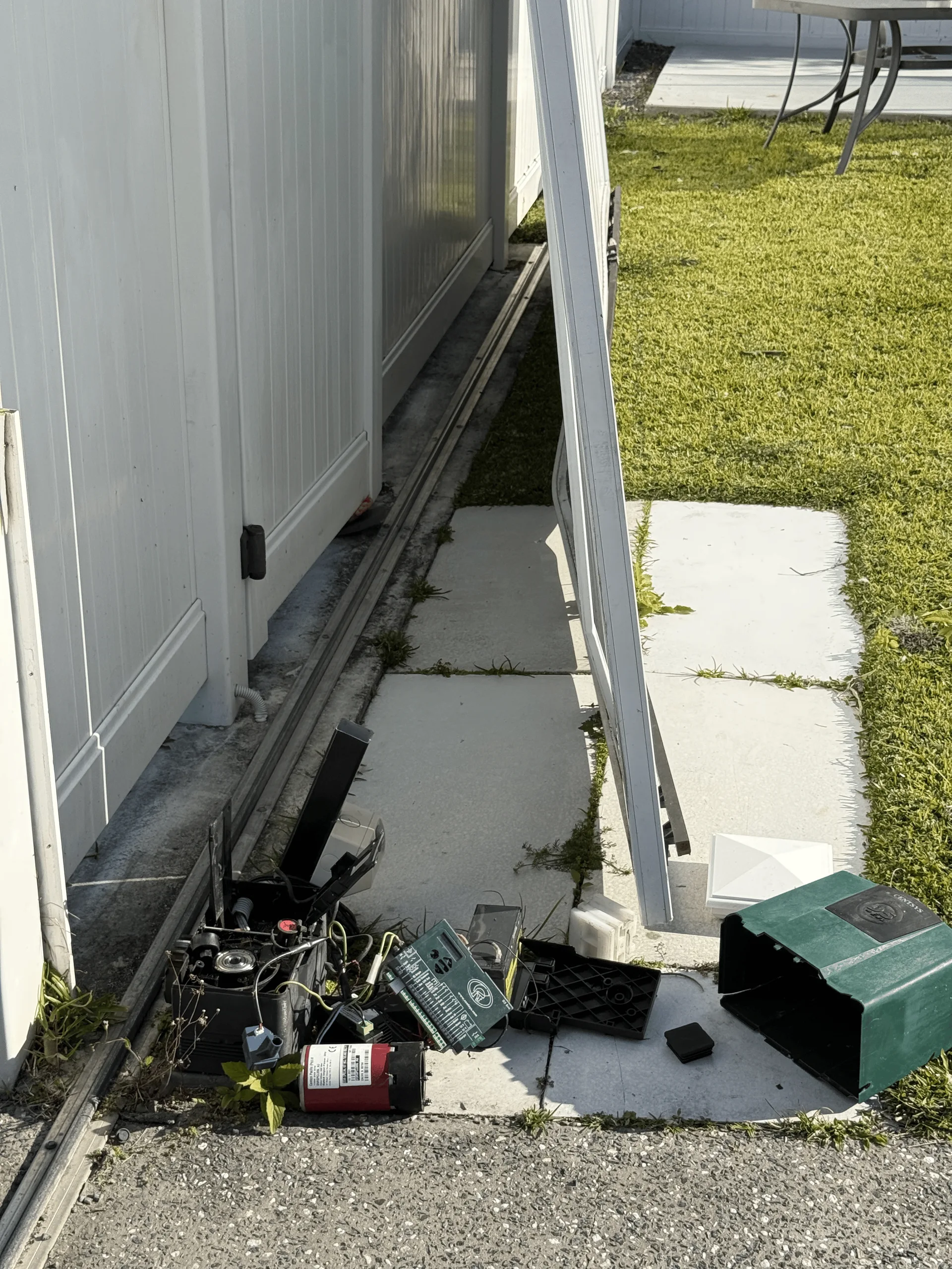 Disconnected sliding gate motor and control board removed from the track, Gold Coast